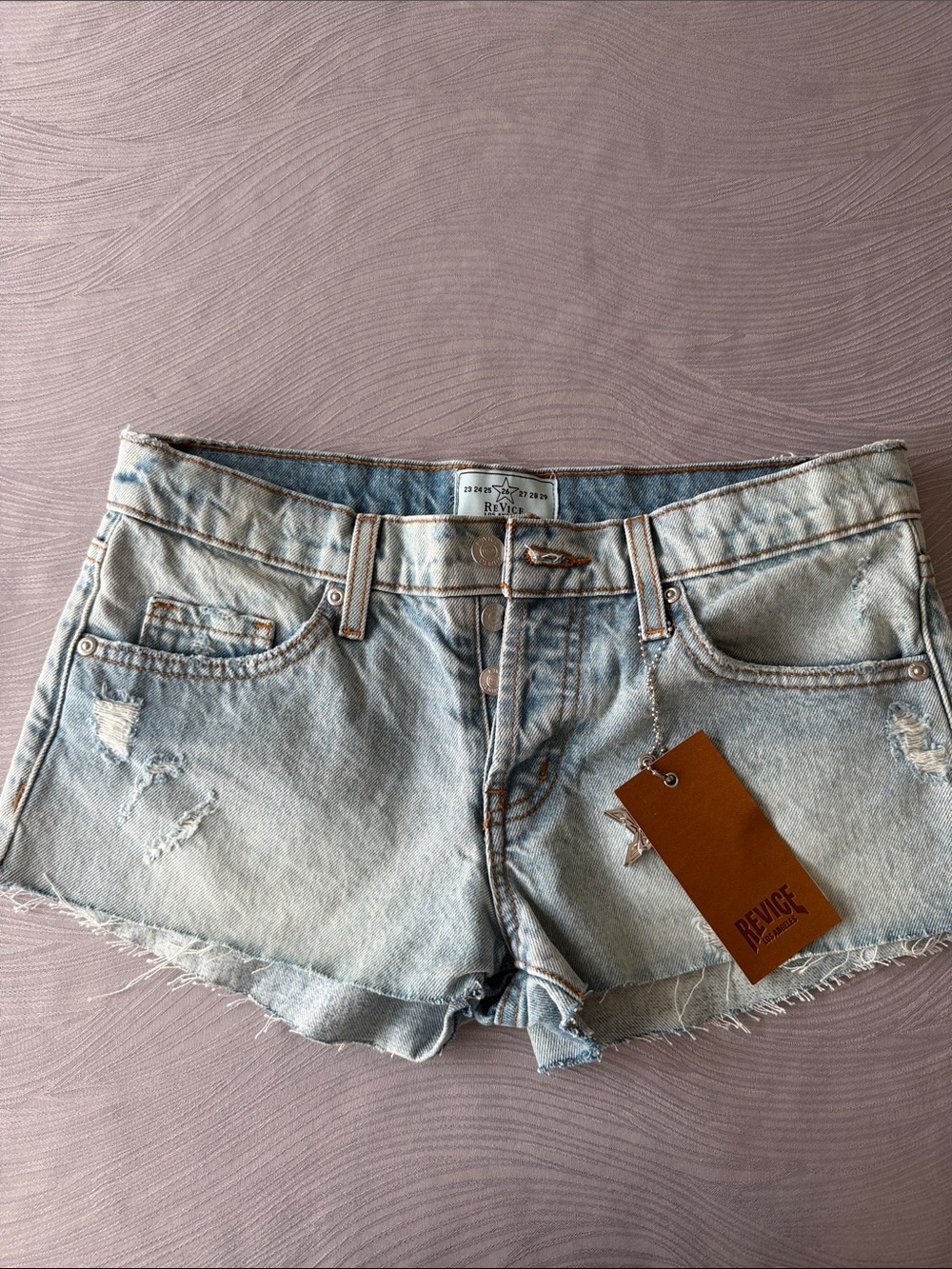 REVICE Faded Light Blue Distressed Denim Shorts